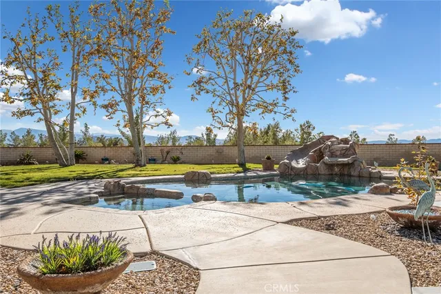 an aerial view of a house with a swimming pool
