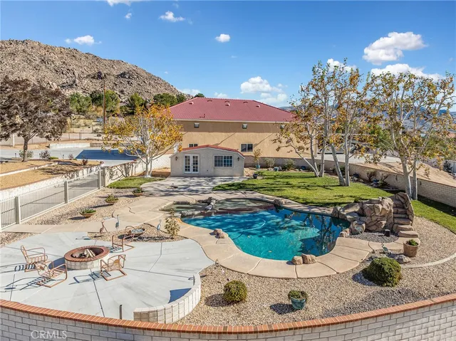 a view of a swimming pool with a patio