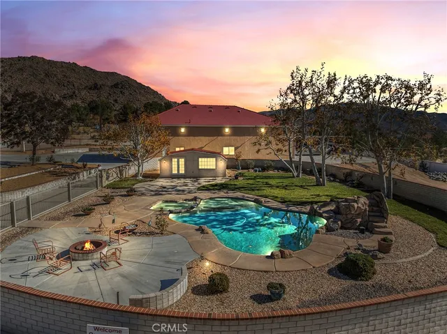 a view of a livingroom with furniture and natural light