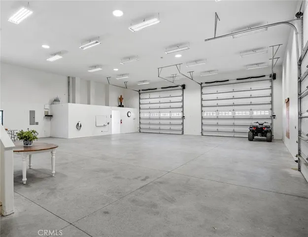 a view of a room with wooden floor and window