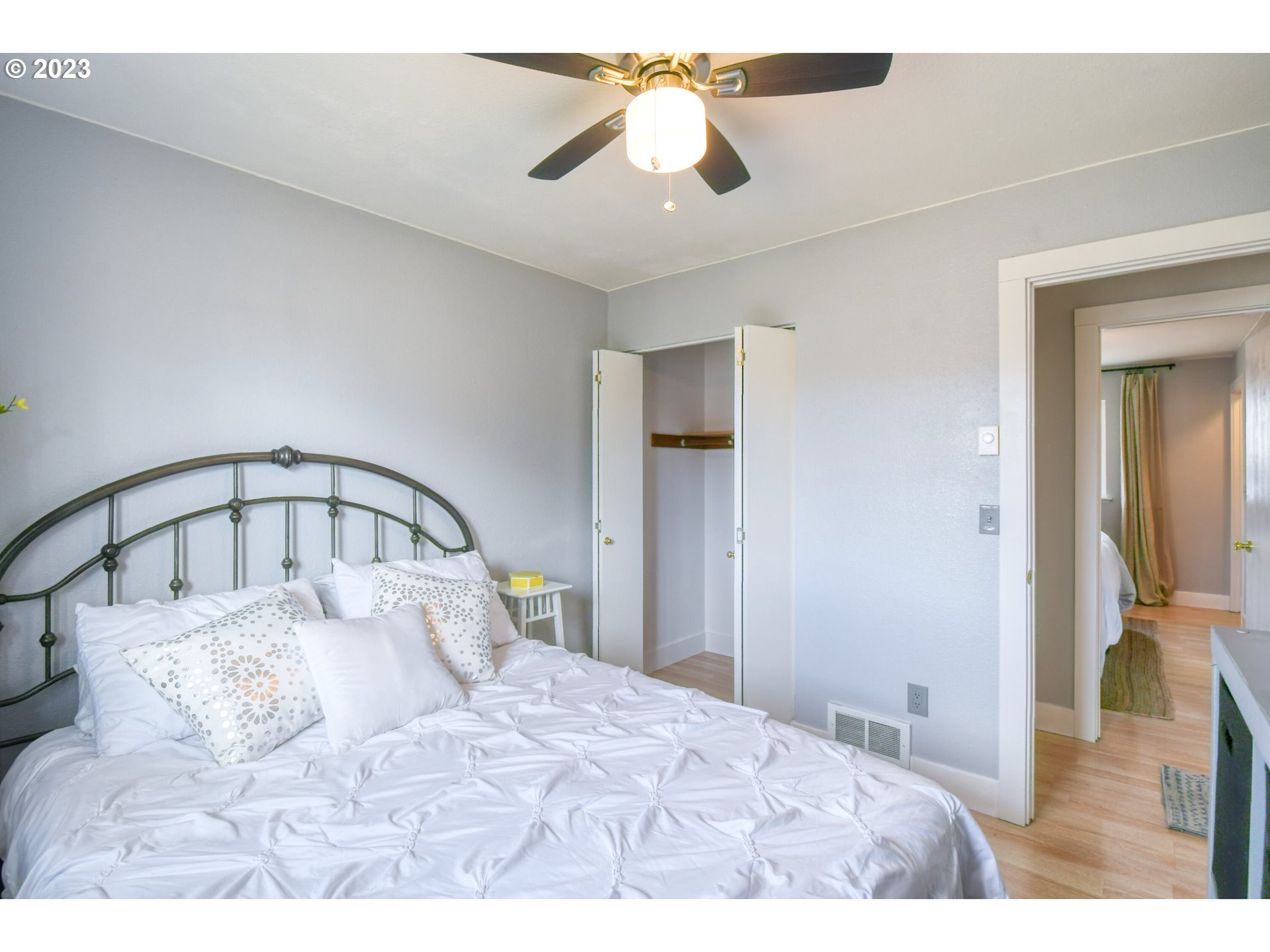 1320 Southwest 37th Street Pendleton, OR 97801 - Photo 22 of 31 a bedroom with a large bed and a chandelier