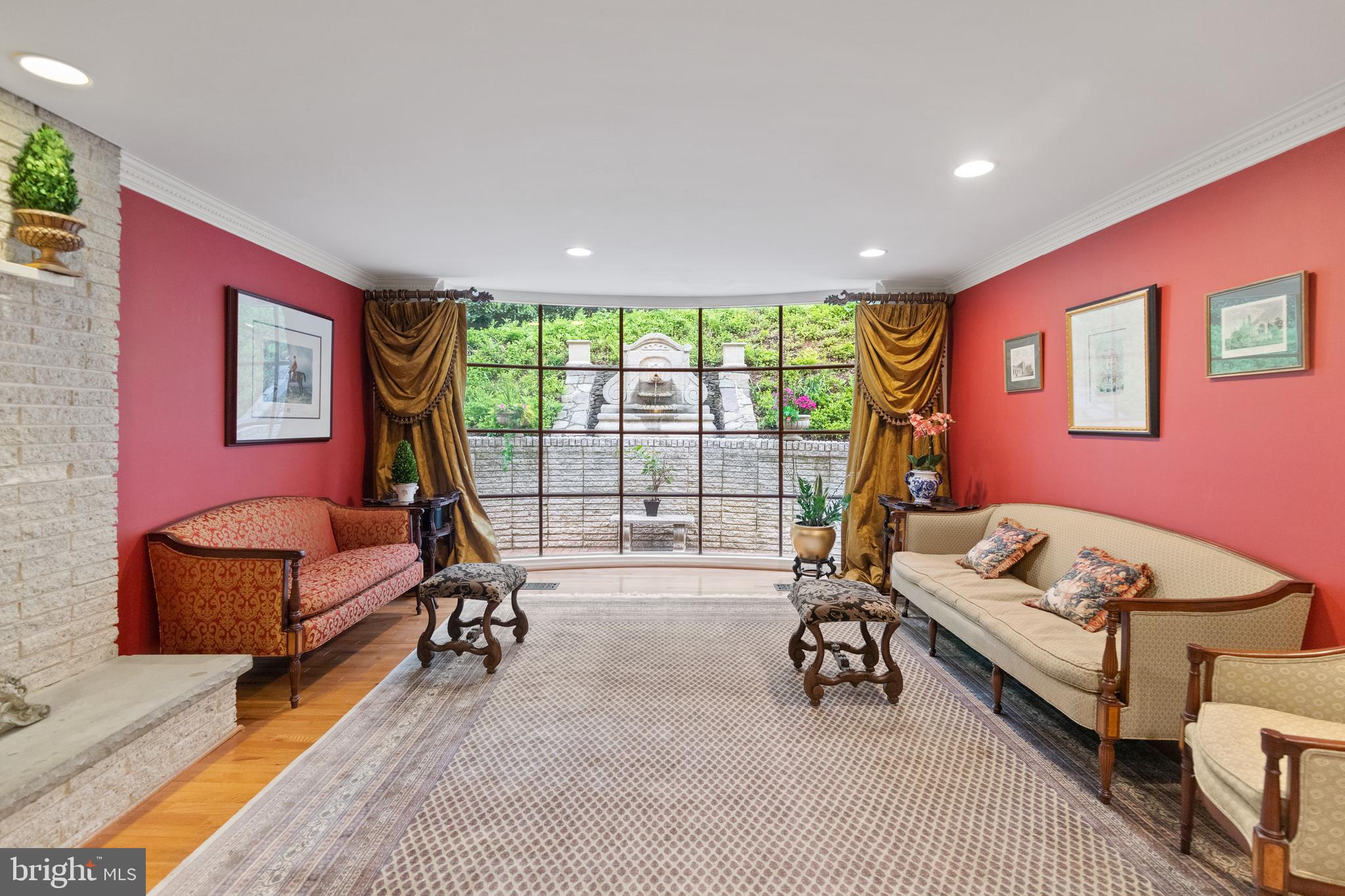 8751 Brook Road McLean, VA 22102 - Photo 12 of 103 a living room with furniture gym equipment and a large window