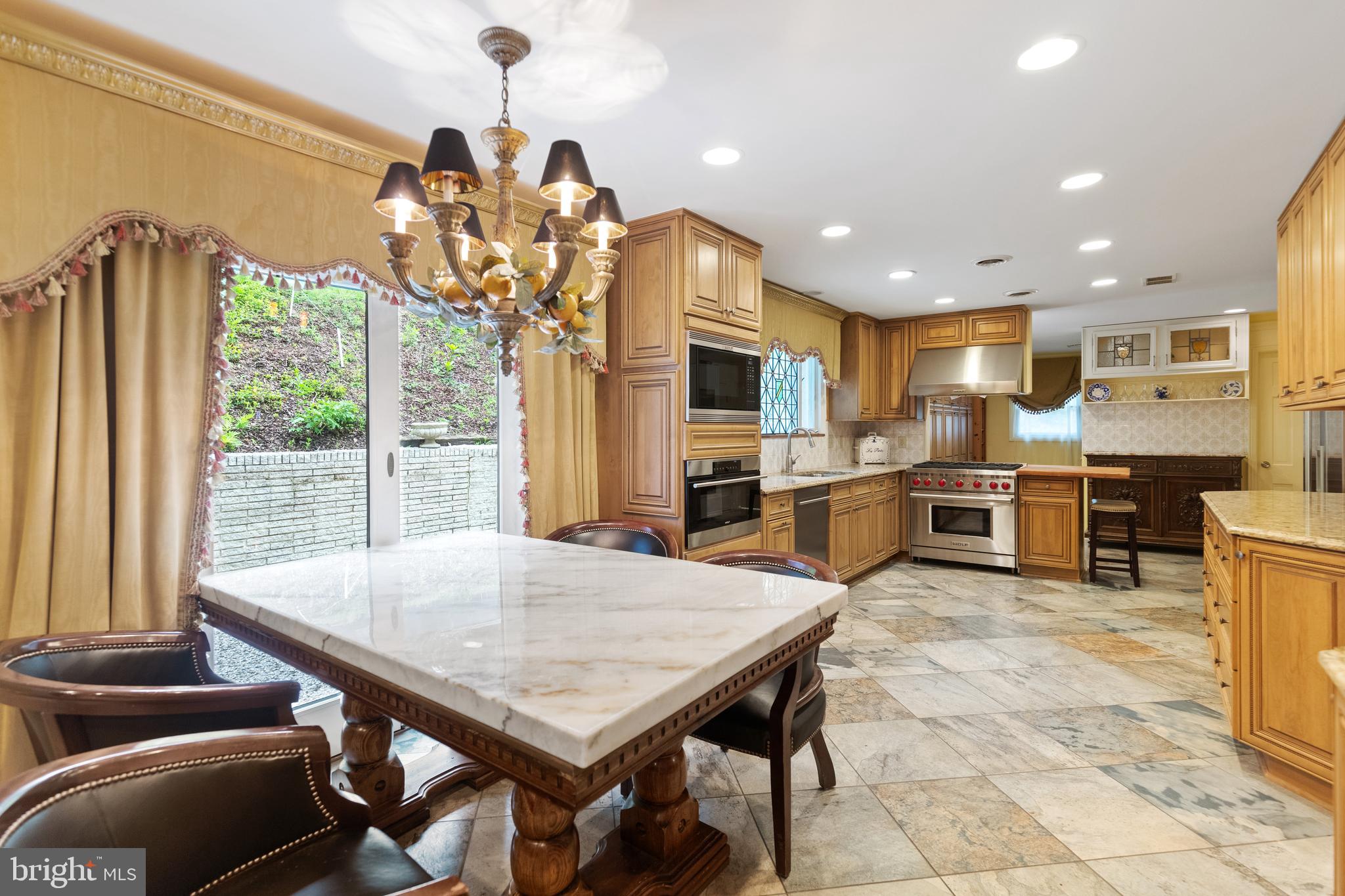 8751 Brook Road McLean, VA 22102 - Photo 14 of 103 a view of a dining room with furniture window and outside view