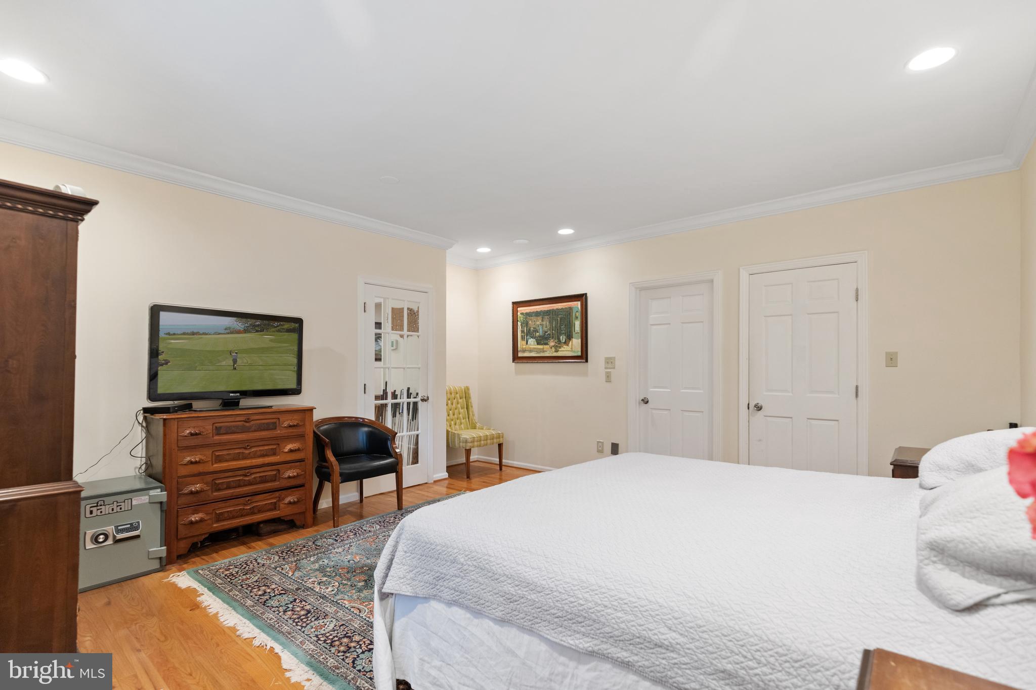 8751 Brook Road McLean, VA 22102 - Photo 31 of 103 a bedroom with a bed and a flat screen tv