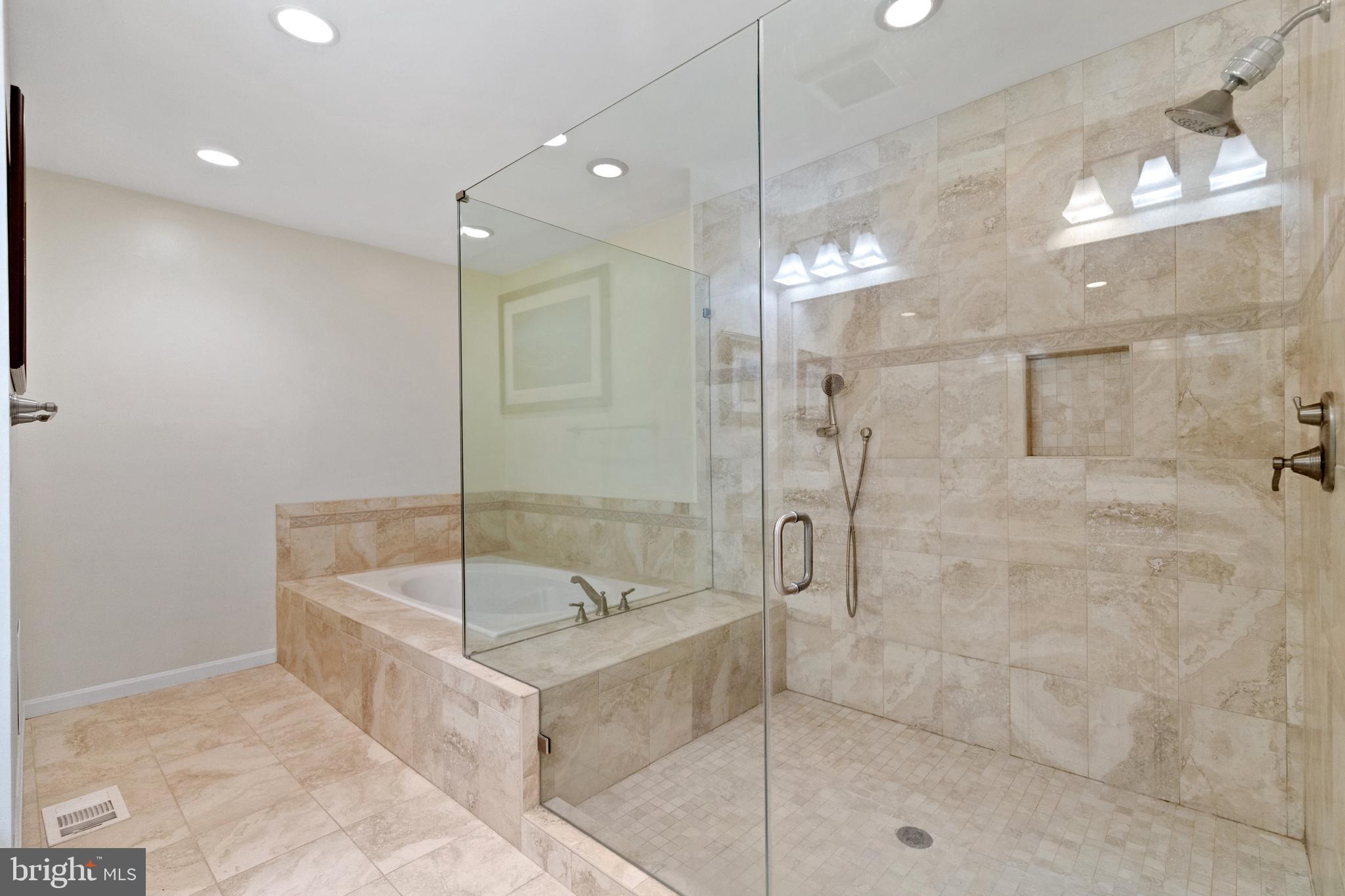 8751 Brook Road McLean, VA 22102 - Photo 33 of 103 a bathroom with a tub and a shower