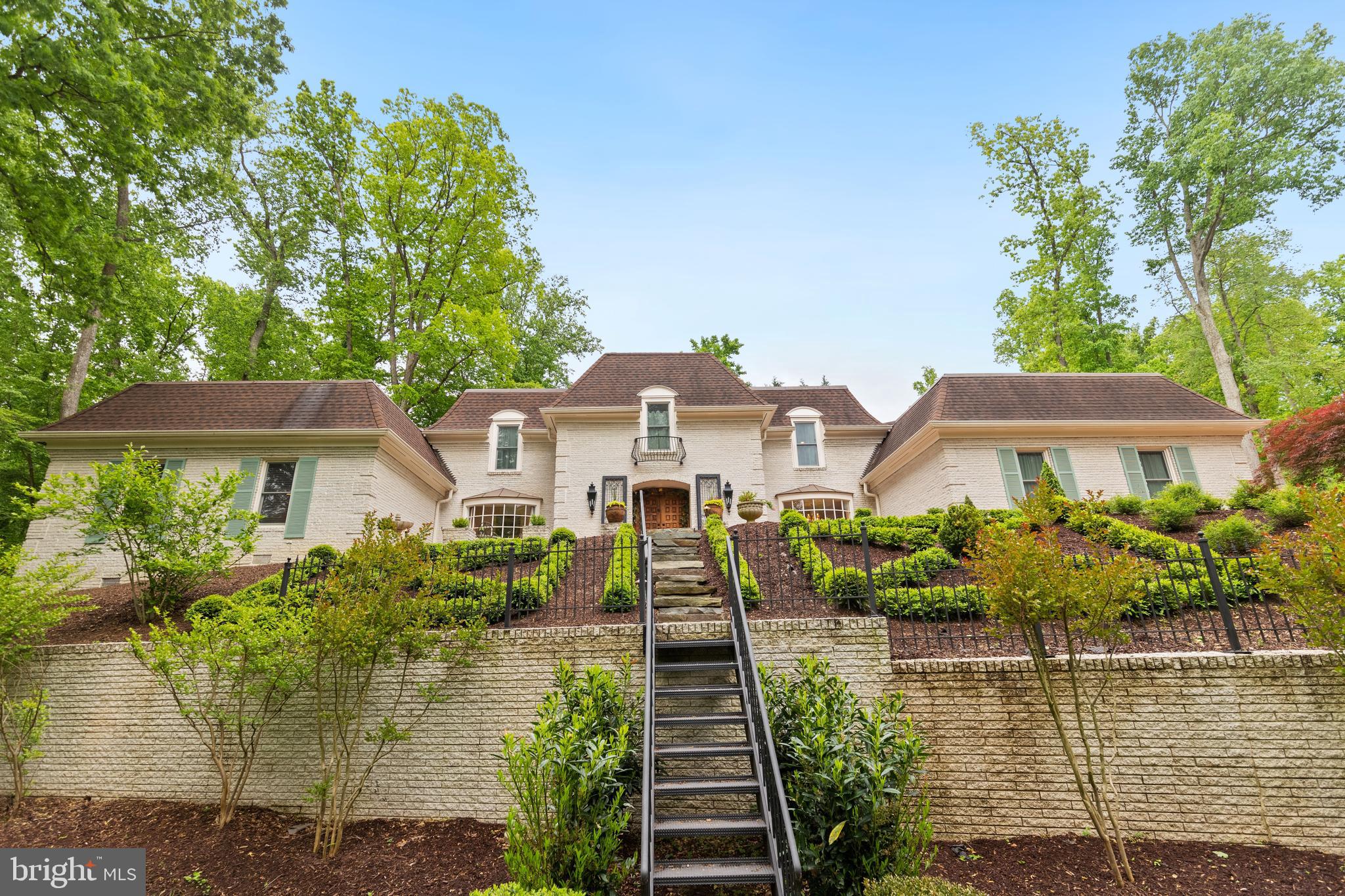 8751 Brook Road McLean, VA 22102 - Photo 57 of 103 a front view of a house with a yard