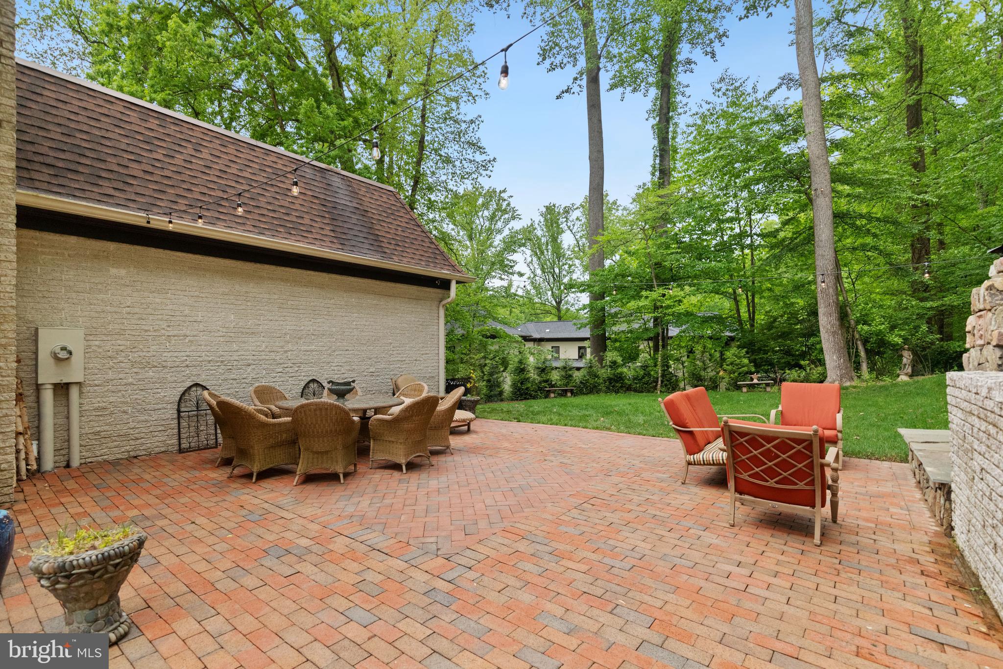 8751 Brook Road McLean, VA 22102 - Photo 65 of 103 a backyard of a house with table and chairs