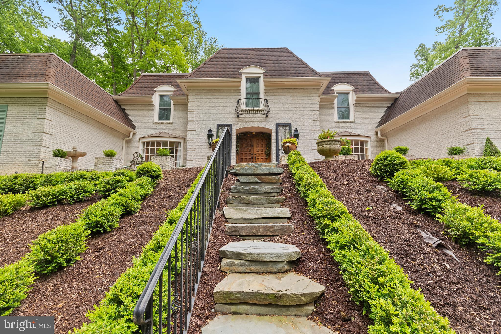8751 Brook Road McLean, VA 22102 - Photo 71 of 103 a front view of a house with a yard