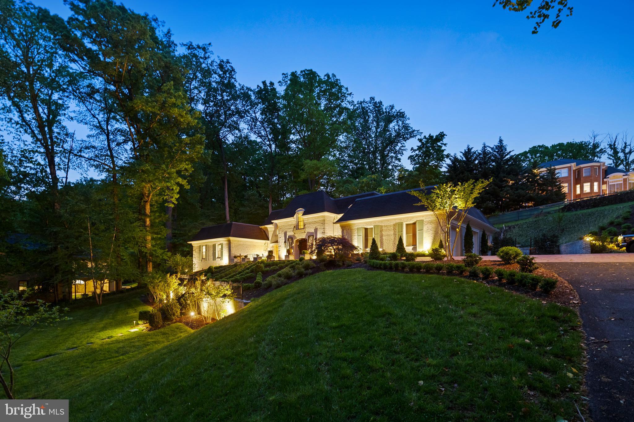8751 Brook Road McLean, VA 22102 - Photo 89 of 103 a front view of a house with a garden