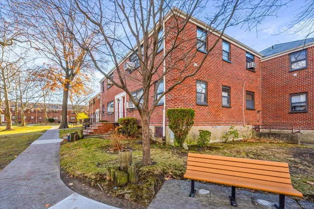 a view of a building with a yard