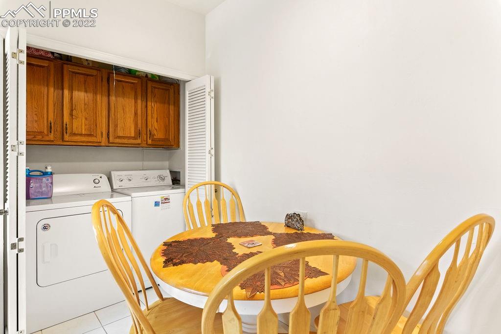 3105 Broadmoor Valley Road, Unit D Colorado Springs, CO 80906 - Photo 14 of 27 a view of a kitchen with a dining table and chairs
