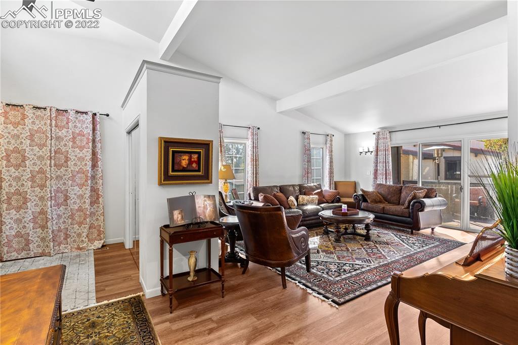 3105 Broadmoor Valley Road, Unit D Colorado Springs, CO 80906 - Photo 3 of 27 a living room with furniture and wooden floor