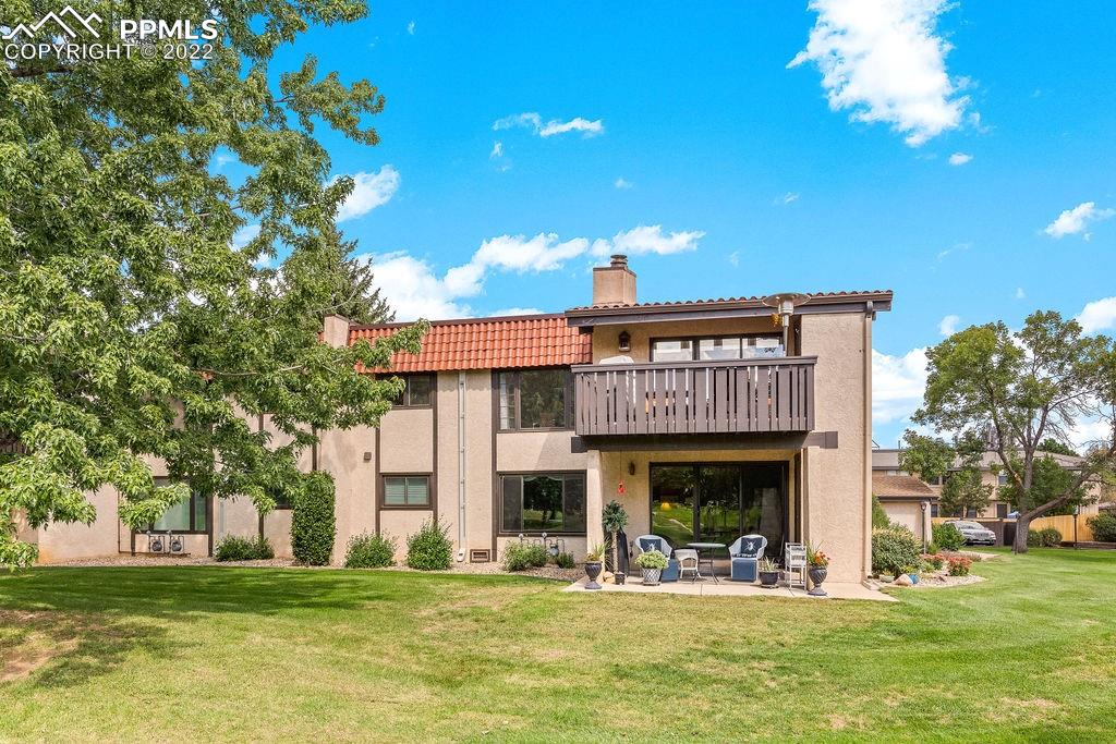 3105 Broadmoor Valley Road, Unit D Colorado Springs, CO 80906 - Photo 8 of 27 a view of a building with a swimming pool
