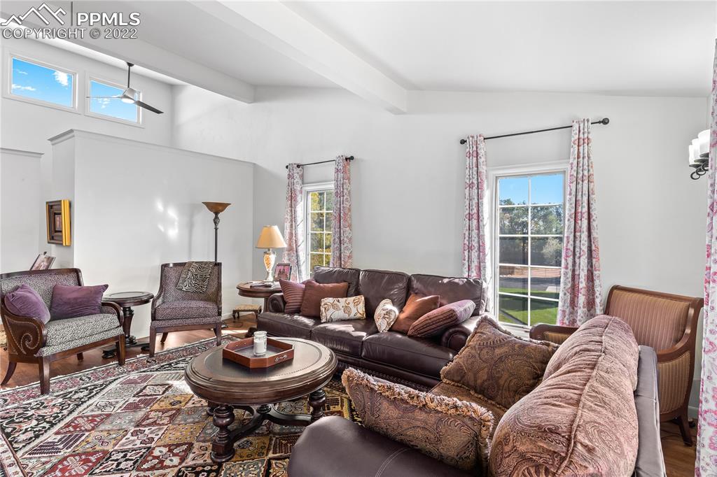 3105 Broadmoor Valley Road, Unit D Colorado Springs, CO 80906 - Photo 10 of 27 a living room with furniture and a large window