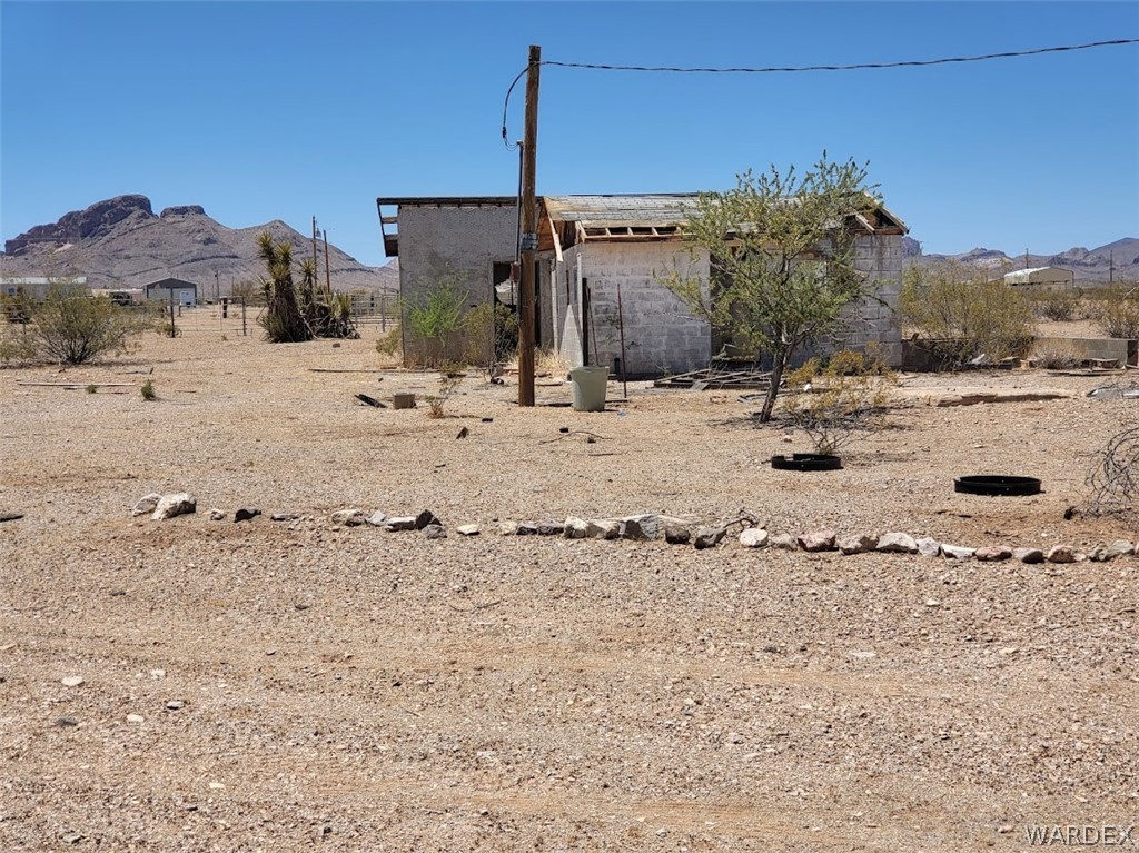 a view of a dry yard covered with snow