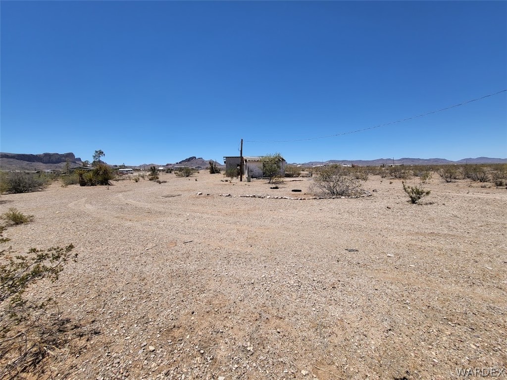 1565 Elgin Road Golden Valley, AZ 86413 - Photo 6 of 6 a view of ocean beach with large trees