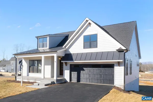 a front view of a house with a garage