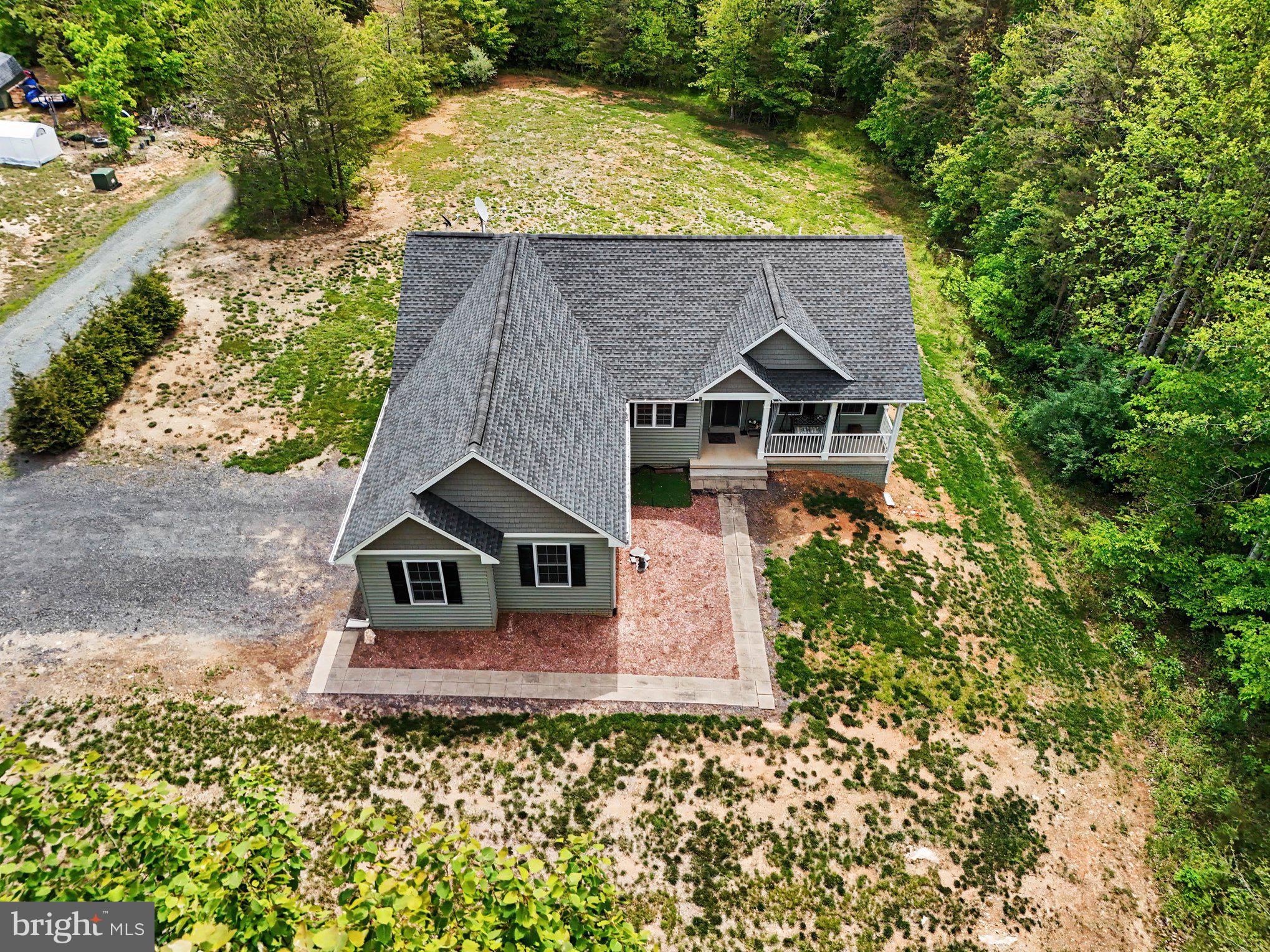 a aerial view of a house with a yard
