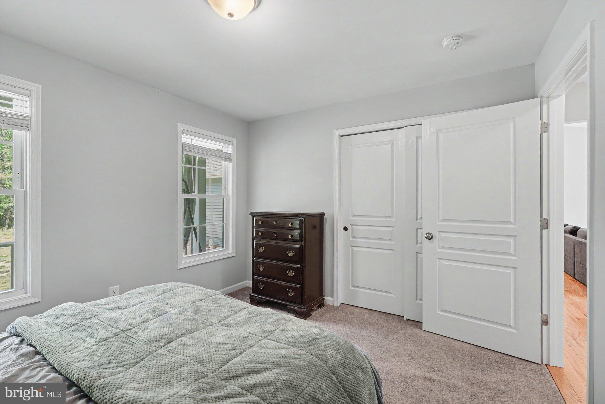 8474 Timothy Lane Rixeyville, VA 22737 - Photo 19 of 49 a bedroom with a bed and a window