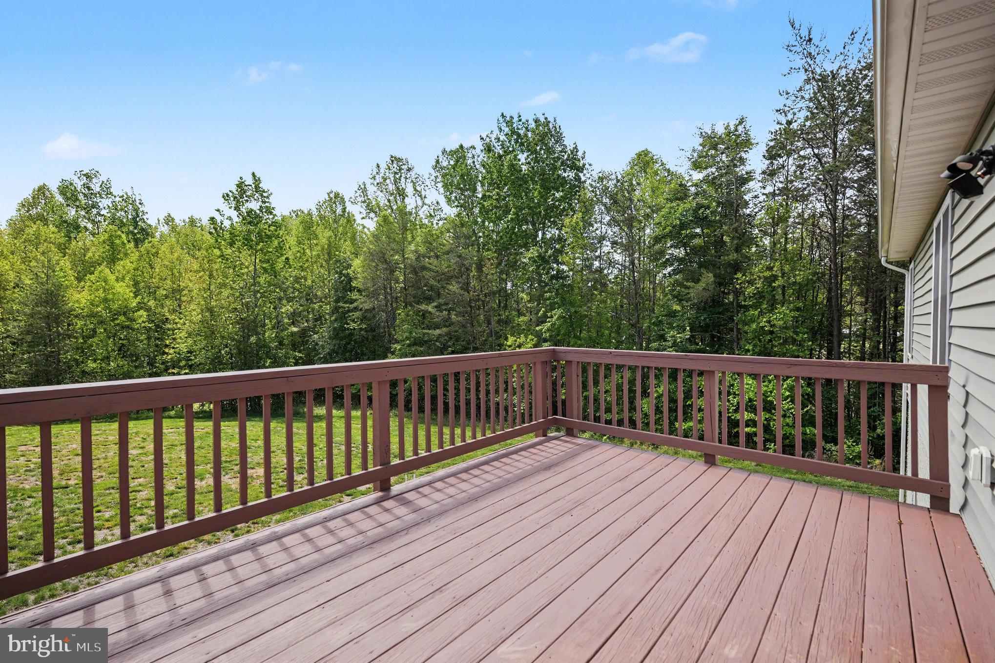 8474 Timothy Lane Rixeyville, VA 22737 - Photo 28 of 49 a balcony with wooden floor and fence