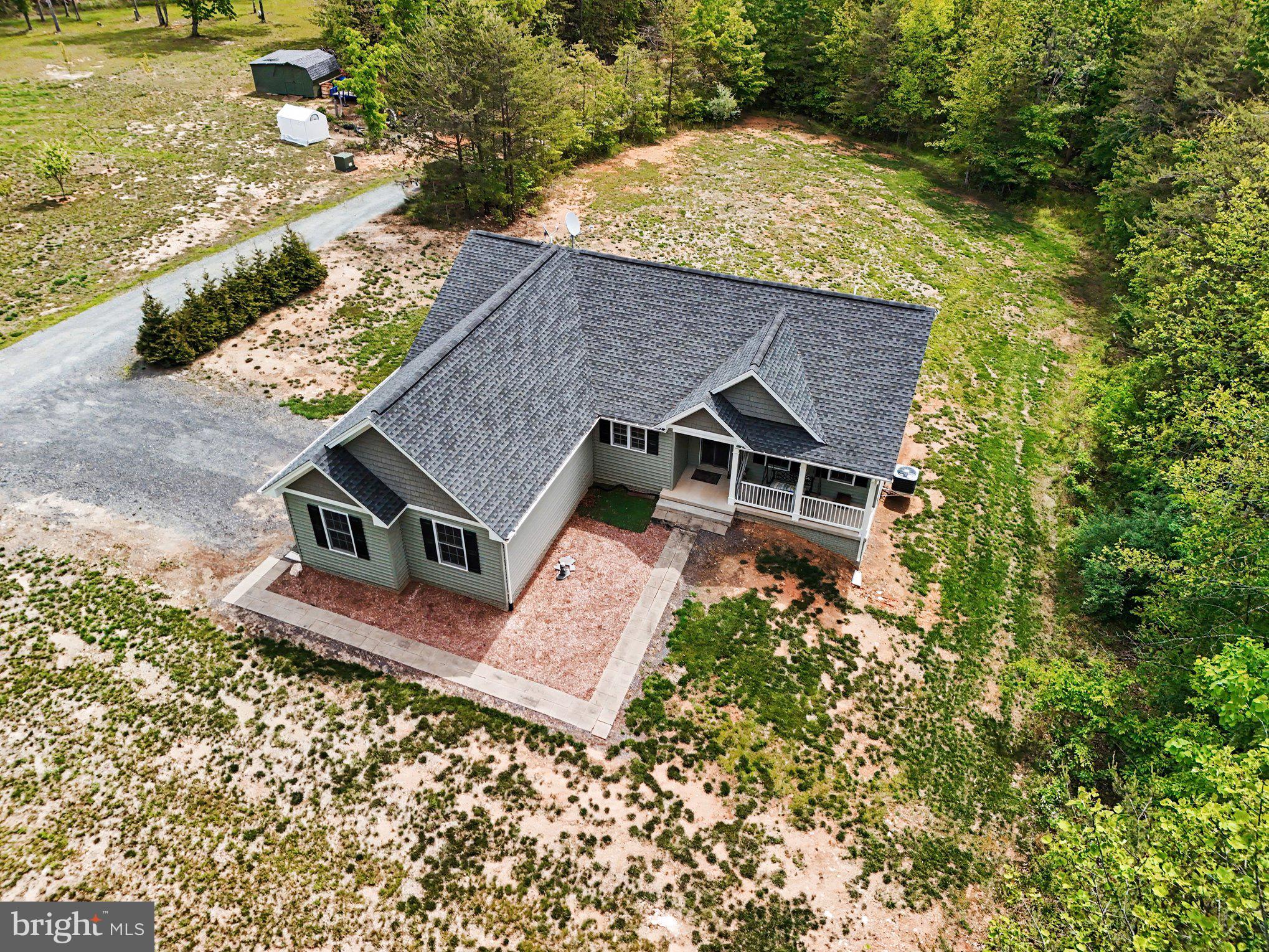 8474 Timothy Lane Rixeyville, VA 22737 - Photo 46 of 49 an aerial view of a house with a yard and lake view