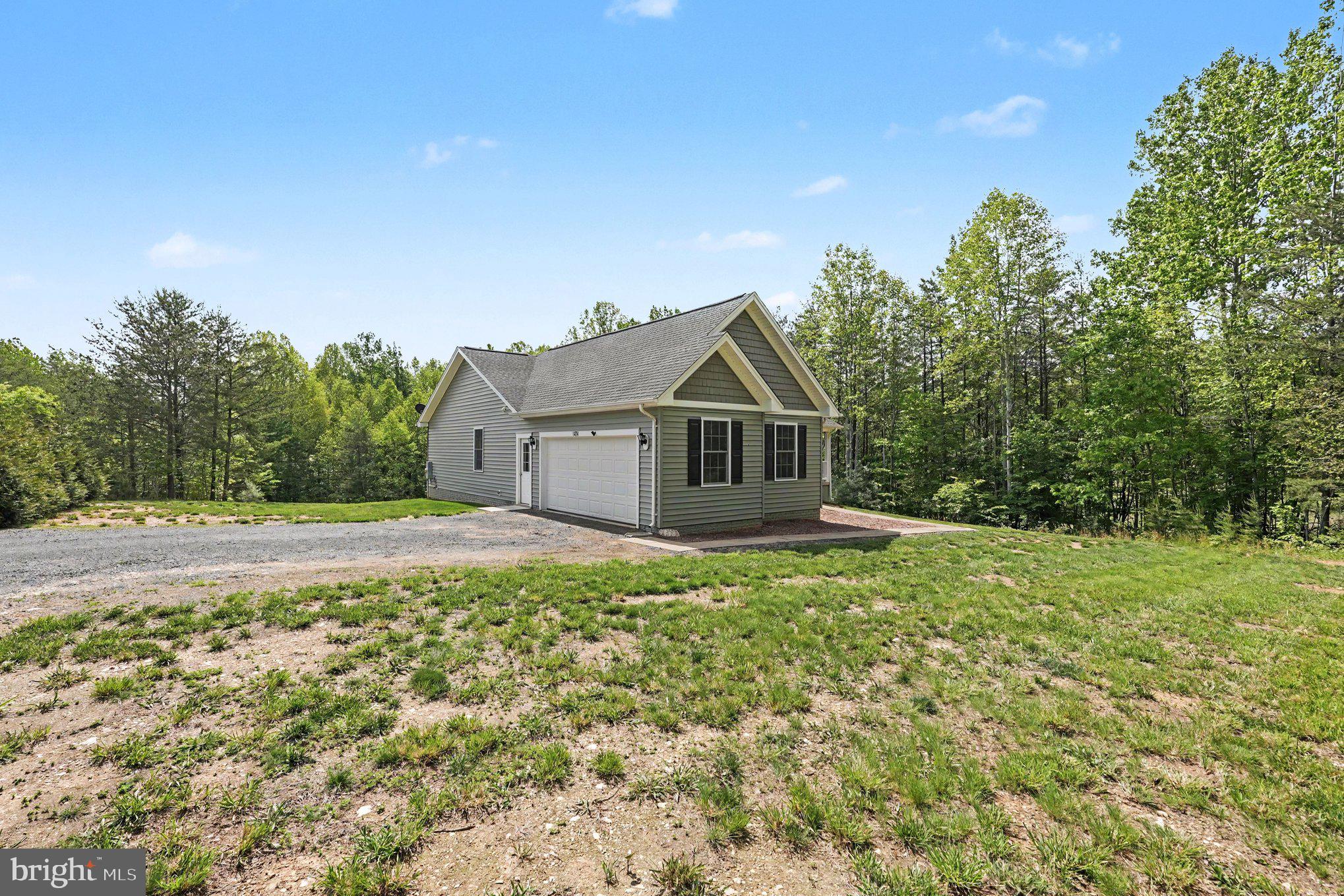 8474 Timothy Lane Rixeyville, VA 22737 - Photo 5 of 49 a house view with a garden space