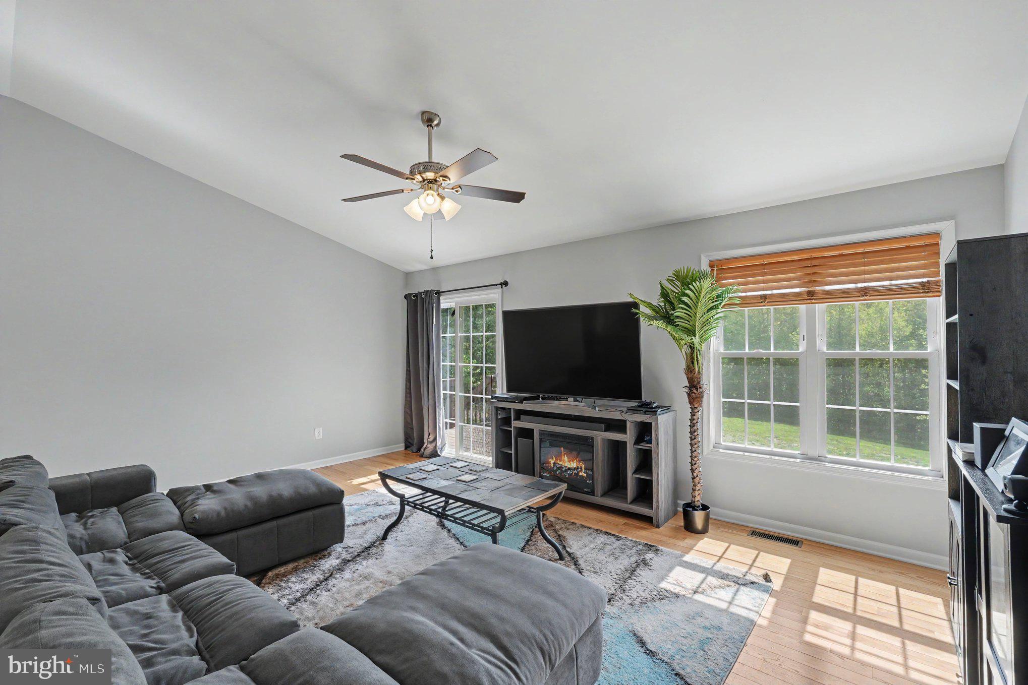 8474 Timothy Lane Rixeyville, VA 22737 - Photo 8 of 49 a living room with furniture and a flat screen tv
