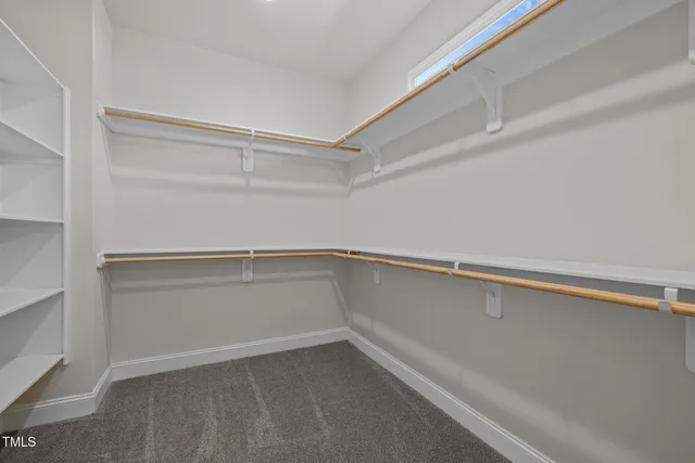 a view of an empty walk in closet