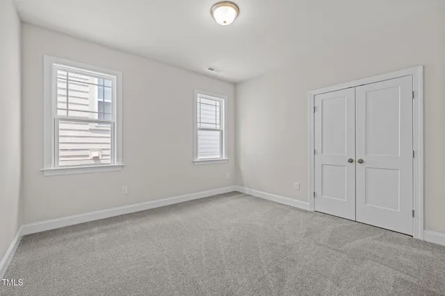 a view of empty room with windows