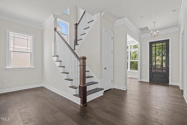 a view of entryway with stairs and wooden floor
