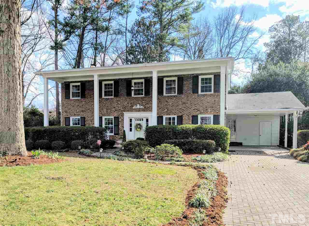 1004 Wofford Lane Raleigh, NC 27609 - Photo 1 of 13 a view of a house with a yard