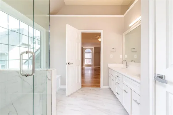 a bathroom with a double vanity sink and mirror