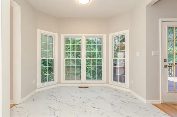 a view of an empty room with a window