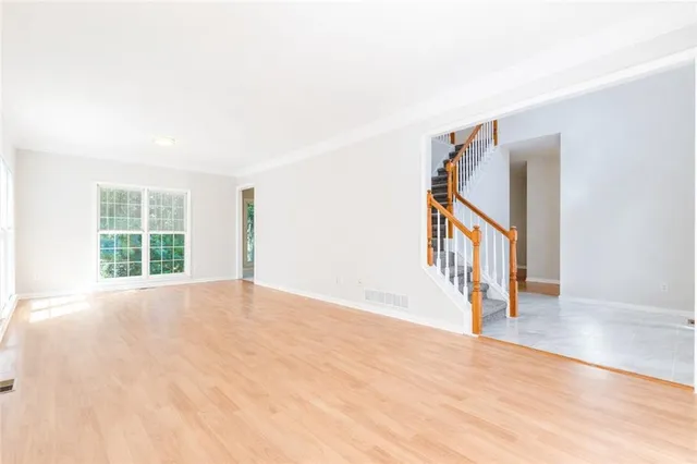 a view of an entryway with wooden floor
