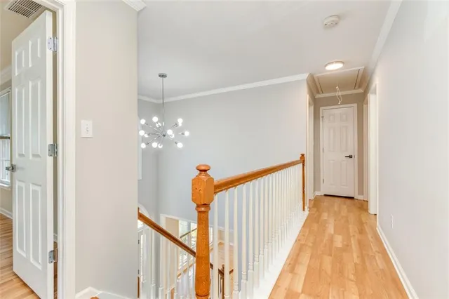 a view of a hallway view with staircase