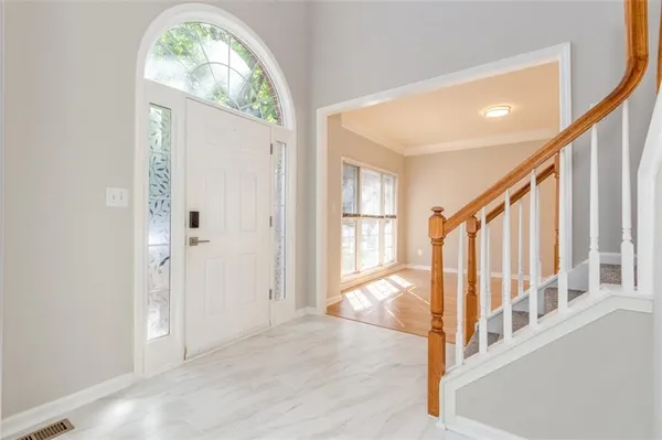 a view of an entryway with staircase