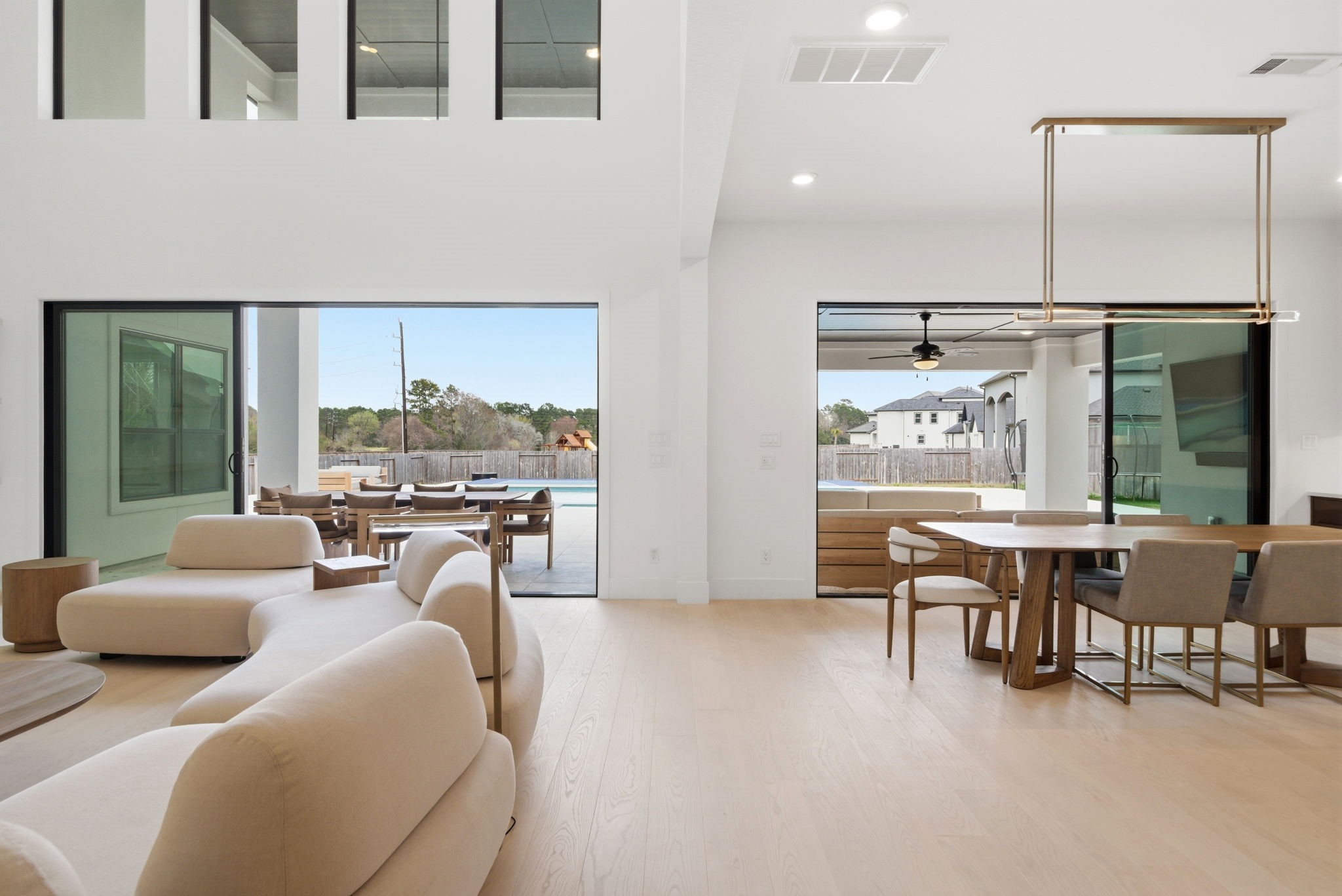 4906 Lagos Lagoon Way Spring, TX 77389 - Photo 12 of 48 Expansive multi-slide glass doors create a seamless connection between the living room and covered patio.