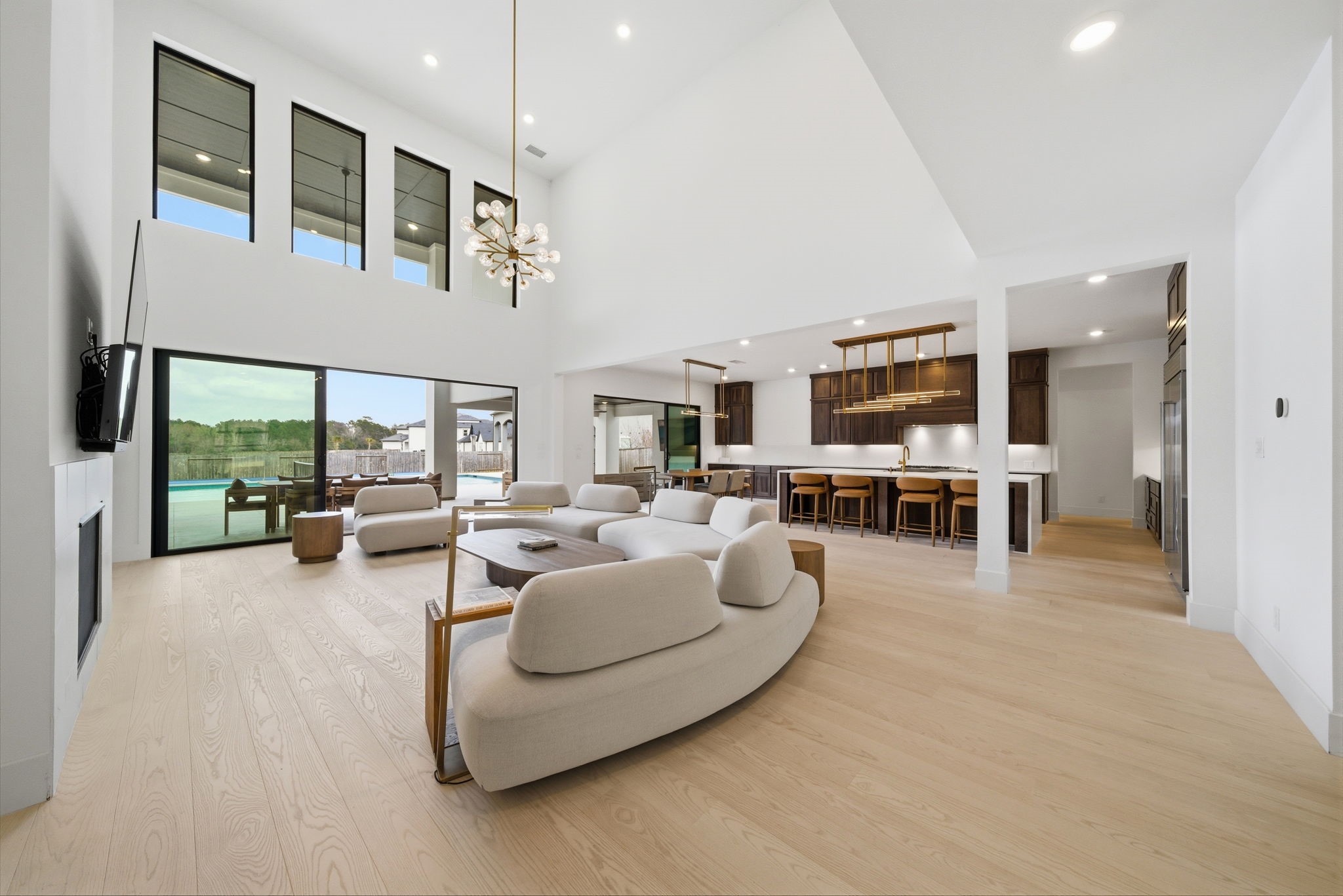 4906 Lagos Lagoon Way Spring, TX 77389 - Photo 13 of 48 Bright open-concept living with dramatic multi-slide doors connecting to the outdoor patio