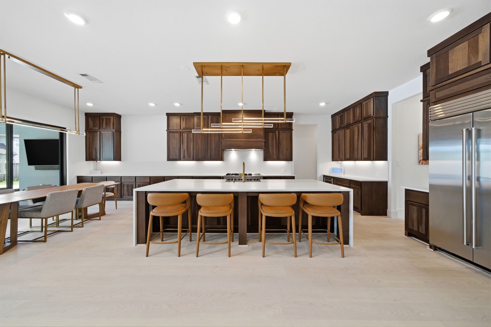 4906 Lagos Lagoon Way Spring, TX 77389 - Photo 14 of 48 Modern chef’s kitchen boasting Benedettine cabinets, high-end Gennair appliances, and Sub-Zero refrigeration