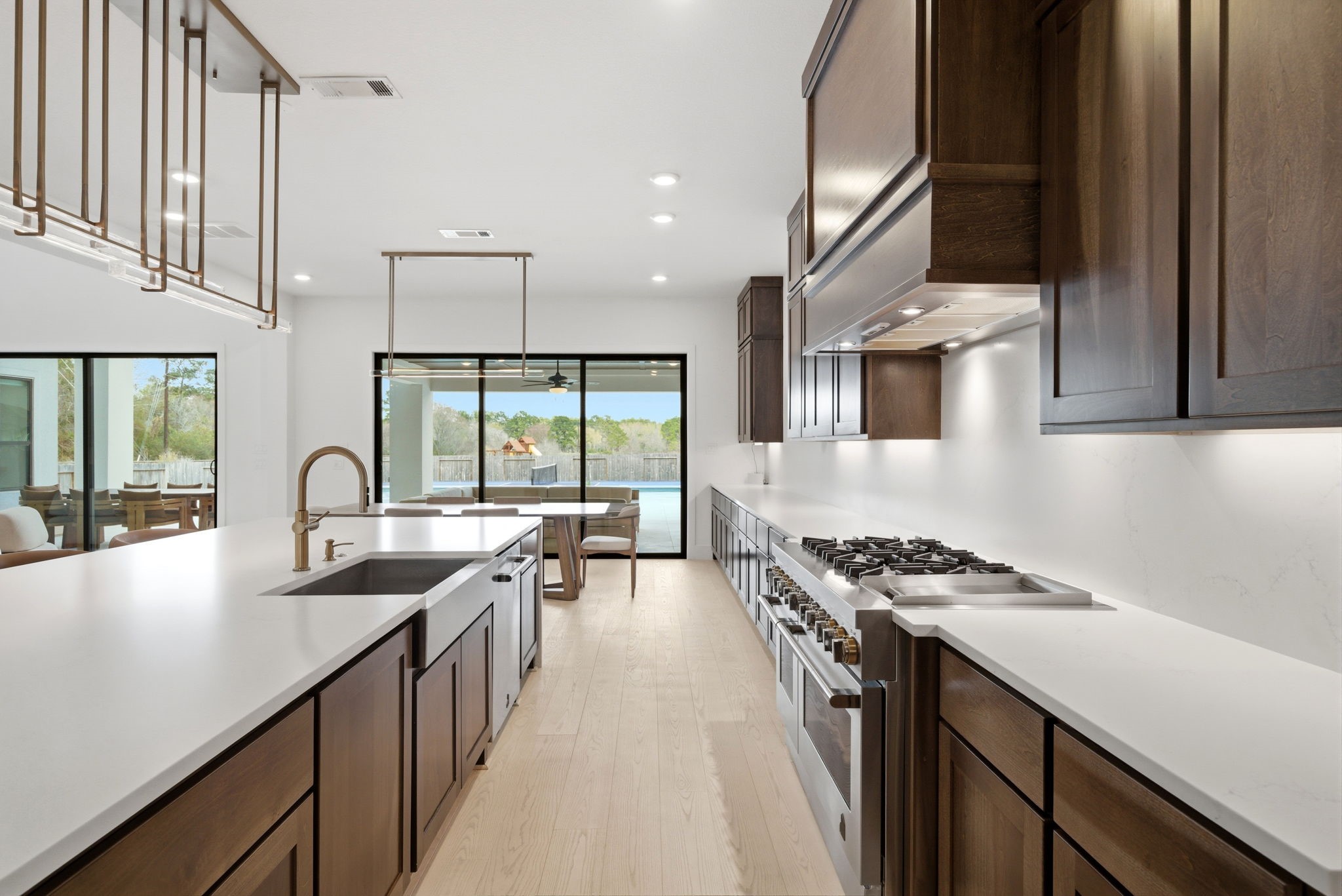 4906 Lagos Lagoon Way Spring, TX 77389 - Photo 18 of 48 Stunning kitchen with statement lighting and expansive prep space