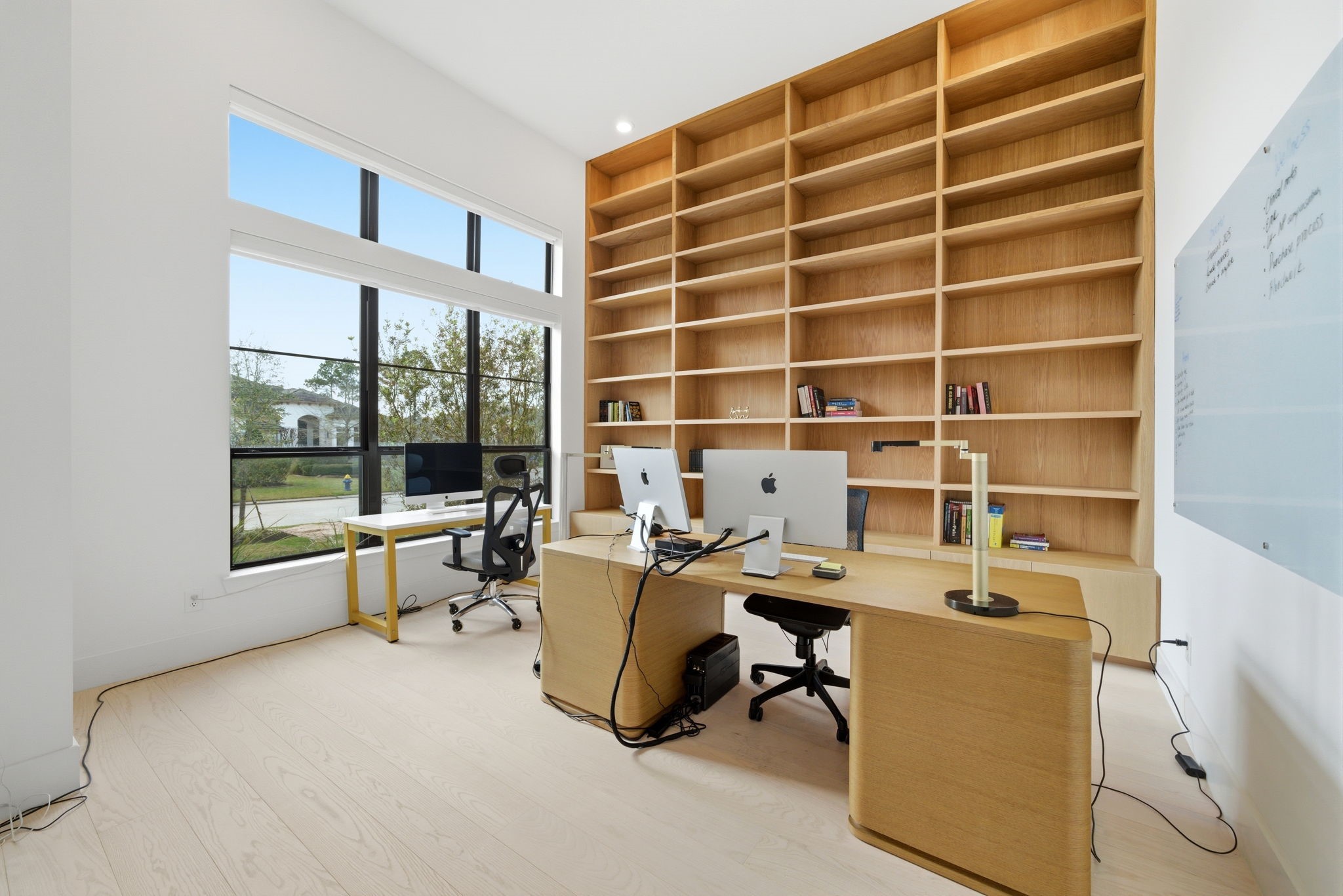 4906 Lagos Lagoon Way Spring, TX 77389 - Photo 24 of 48 Elegant home office featuring custom floor-to-ceiling bookshelves and abundant natural light