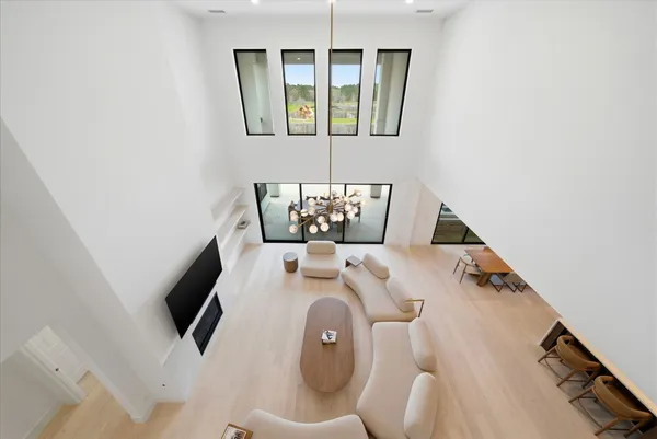 a front view of a house with swimming pool and porch