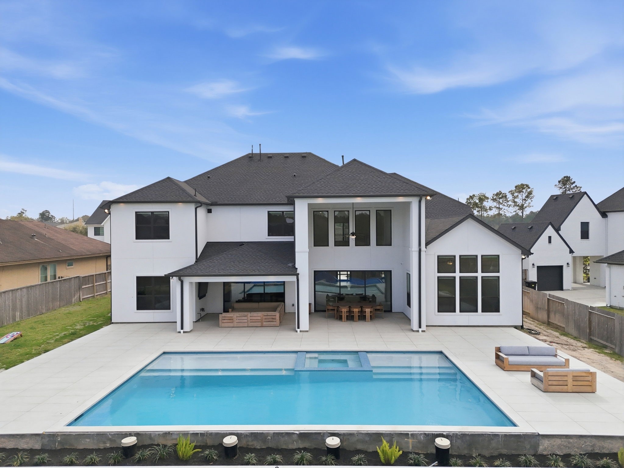 4906 Lagos Lagoon Way Spring, TX 77389 - Photo 40 of 48 Modern pool area perfect for entertaining or relaxing in style