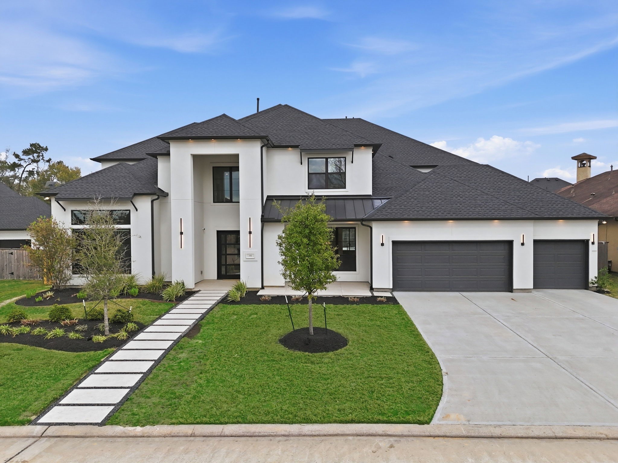 4906 Lagos Lagoon Way Spring, TX 77389 - Photo 4 of 48 Striking modern façade with clean architectural lines and designer finishes