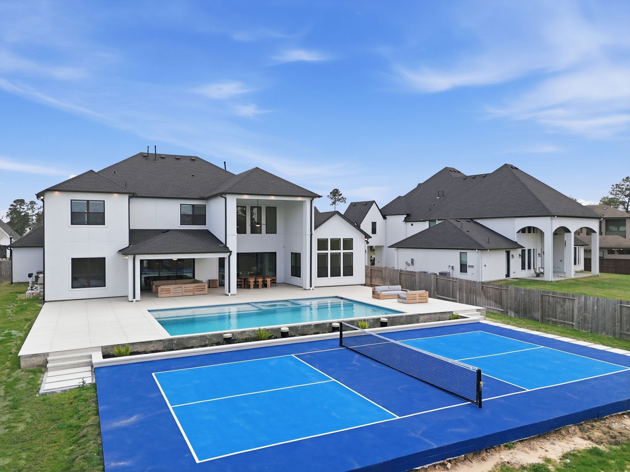 4906 Lagos Lagoon Way Spring, TX 77389 - Photo 41 of 48 Private outdoor retreat with sleek pool and versatile pickleball court.