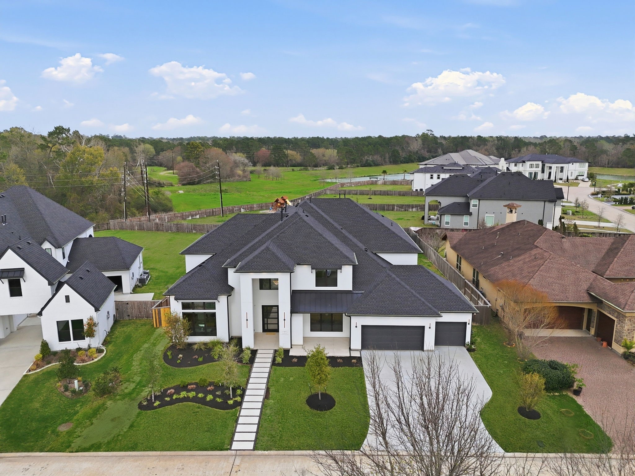 4906 Lagos Lagoon Way Spring, TX 77389 - Photo 43 of 48 Stunning aerial view showcasing the home’s modern architecture and landscaped front yard.