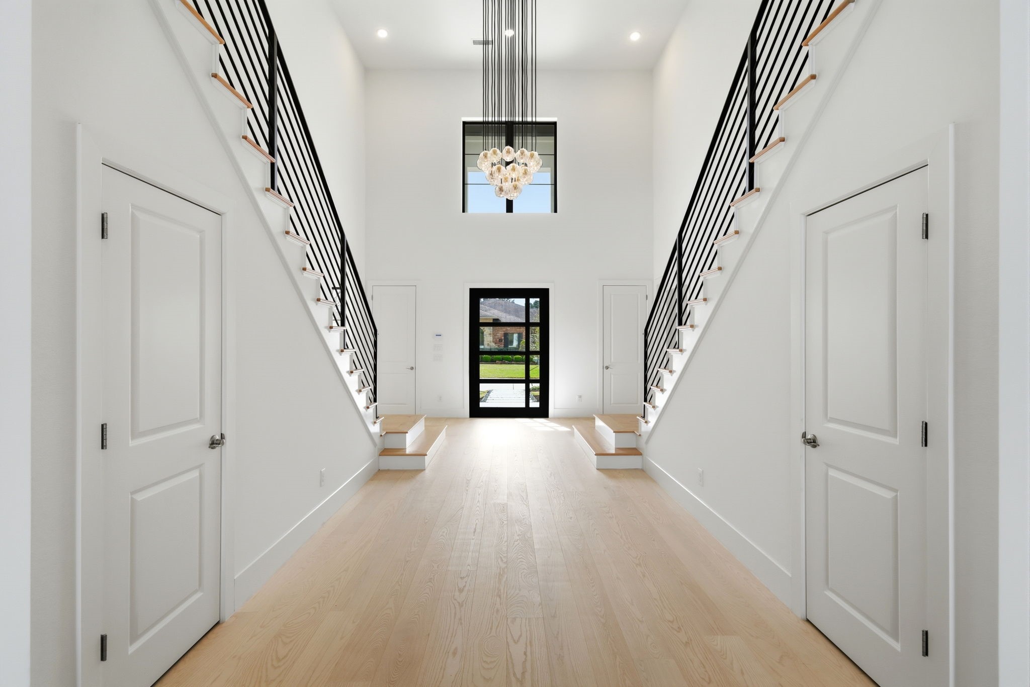 4906 Lagos Lagoon Way Spring, TX 77389 - Photo 8 of 48 Light-filled entrance with refined finishes and architectural detail.