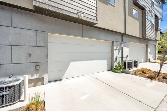 7713 Navarro View Court Midvale, UT 84047 - Photo 4 of 41 Modern exterior with horizontal siding and block-style accent panels