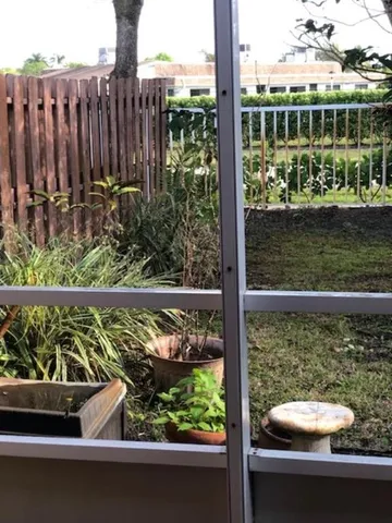 a view of a chair and table in the balcony