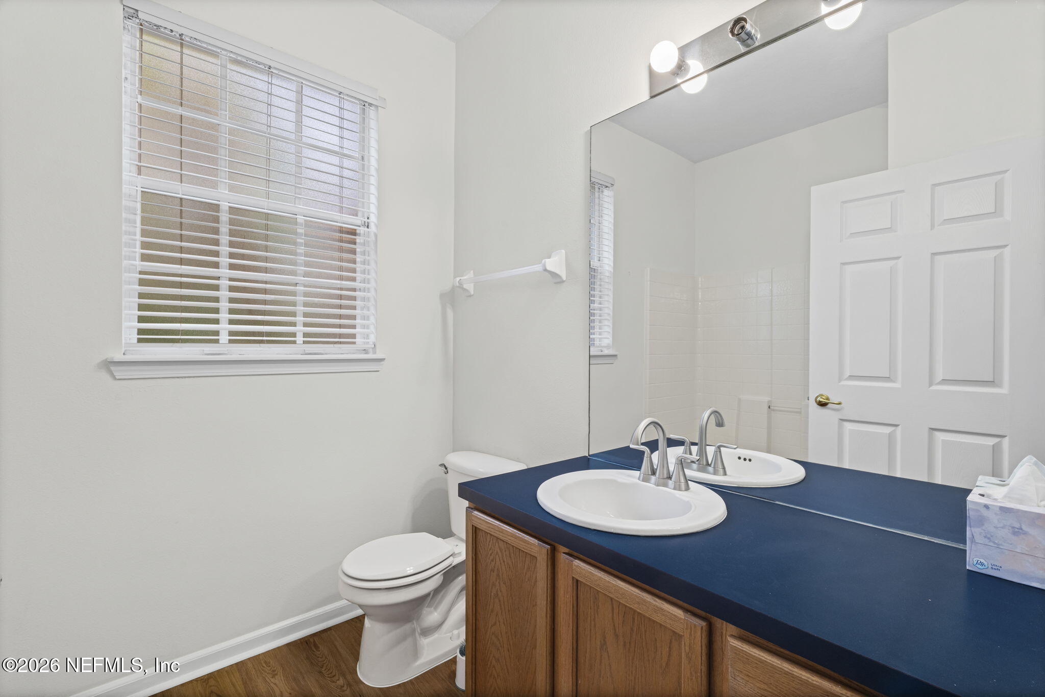 10550 Baymeadows Road, Unit 601 Jacksonville, FL 32256 - Photo 12 of 37 a bathroom with a sink a toilet and a mirror